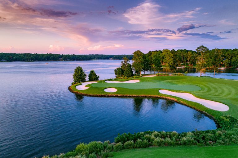 an aerial view of Lake Oconee and a golf course hole