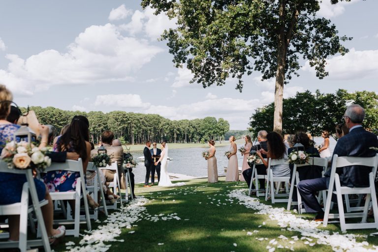 A wedding taking place outside overlooking Lake Oconee